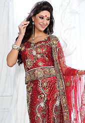 Be the cynosure of all eyes with this wonderful casual wear in flattering colors and combinations. This red net lehenga is nicely embroidered patch work is done with stone, zardosi, cutdana and cutbeads work. The beautiful embroidery on lehenga made it awesome and gives you stylish and attractive look to others. Matching choli and dupatta is availble with this lehenga. Slight Color variations are possible due to differing screen and photograph resolutions.