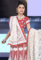 Outfit is a novel ways of getting yourself noticed. This off white and red net lehenga is nicely embroidered patch work is done with resham, stone and lace work. The beautiful embroidery on lehenga made it awesome and gives you stylish and attractive look to others. Matching red choli and off white dupatta is availble with this lehenga. Slight Color variations are possible due to differing screen and photograph resolutions.