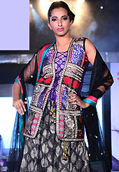 Elegance and innovation of designs crafted for you. This black and purple net lehenga is nicely embroidered patch work is done with resham, zari, stone and lace work. The beautiful embroidery on lehenga made it awesome and gives you stylish and attractive look to others. Contrasting purple choli, embroidered work jacket and black net dupatta is availble with this lehenga. Slight Color variations are possible due to differing screen and photograph resolutions.