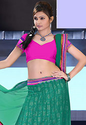 No one like ordinary look, because every woman has their own beauty and our collection gives extra ordinary look to you. This green and magenta net lehenga is nicely embroidered patch work is done with resham, zari, sequins and lace work. The beautiful embroidery on lehenga made it awesome and gives you stylish and attractive look to others. Matching magenta choli and green dupatta is availble with this lehenga. Slight Color variations are possible due to differing screen and photograph resolutions.