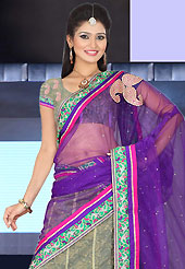 Bold colors created by the inventive drapes of textile catch the imagination like no other contemporary clothing. This dusty grey net lehenga is nicely embroidered patch work is done with resham, zari, stone and lace work. The beautiful embroidery on lehenga made it awesome and gives you stylish and attractive look to others. Matching choli and purple net dupatta is availble with this lehenga. Slight Color variations are possible due to differing screen and photograph resolutions.
