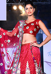 Dreamy variation on shape and forms compliment your style with tradition. This dark red net and brocade lehenga is nicely embroidered patch work is done with resham, zari, sequins, stone, lace and latken work. The beautiful embroidery on lehenga made it awesome and gives you stylish and attractive look to others. Matching choli and dupatta is availble with this lehenga. Slight Color variations are possible due to differing screen and photograph resolutions.