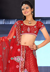 Outfit is a novel ways of getting yourself noticed. This red net lehenga is nicely embroidered patch work is done with resham, zari, sequins, stone and lace work. The beautiful embroidery on lehenga made it awesome and gives you stylish and attractive look to others. Matching choli and dupatta is availble with this lehenga. Slight Color variations are possible due to differing screen and photograph resolutions.