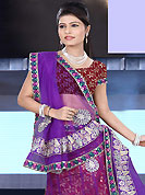Make your collection more attractive and charming with this impressive dress. This purple and red net and brocade lehenga is nicely embroidered patch work is done with resham, zari, sequins, stone and lace work. The beautiful embroidery on lehenga made it awesome and gives you stylish and attractive look to others. Matching dark red choli and purple net dupatta is availble with this lehenga. Slight Color variations are possible due to differing screen and photograph resolutions.