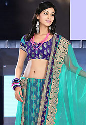 Elegance and innovation of designs crafted for you. This aqua blue and dark blue net and brocade lehenga is nicely embroidered patch work is done with resham, zari, sequins, stone and lace work. The beautiful embroidery on lehenga made it awesome and gives you stylish and attractive look to others. Matching dark blue choli and aqua blue net dupatta is availble with this lehenga. Slight Color variations are possible due to differing screen and photograph resolutions.