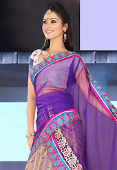 Embroidered lehengas are highly in order on a range of occasions such as wedding, formal party and festivals. This beige net lehenga is nicely embroidered patch work is done with resham, zari, sequins and lace work. The beautiful embroidery on lehenga made it awesome and gives you stylish and attractive look to others. Contrasting off white choli and purple net dupatta is availble with this lehenga. Slight Color variations are possible due to differing screen and photograph resolutions.