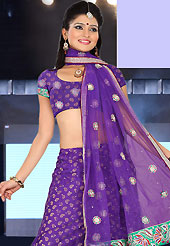 The evolution of style species collection spells pure femininity. This purple net and brocade lehenga is nicely embroidered patch work is done with resham, zari, sequins, stone and lace work. The beautiful embroidery on lehenga made it awesome and gives you stylish and attractive look to others. Matching choli and dupatta is availble with this lehenga. Slight Color variations are possible due to differing screen and photograph resolutions.
