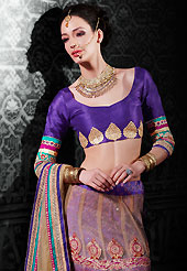 Get ready to sizzle all around you by sparkling lehenga. This fawn and dark pink net a-line lehenga choli is nicely embroidered patch border is done with resham, zari, sequins, stone and lace work. The beautiful embroidery on lehenga made it awesome and gives you stylish and attractive look to others. Contrasting purple art silk choli and fawn net dupatta is availble with this lehenga. Slight Color variations are possible due to differing screen and photograph resolutions.