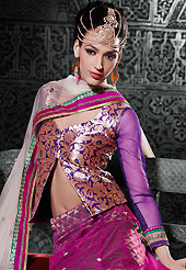 It’s cool and has a very modern look to impress all. This magenta net a-line lehenga choli is nicely embroidered patch border is done with zari, stone and lace work. The beautiful embroidery on lehenga made it awesome and gives you stylish and attractive look to others. Contrasting purple brocade and net choli and off white net dupatta is availble with this lehenga. Slight Color variations are possible due to differing screen and photograph resolutions.