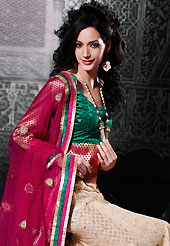 Embroidered lehengas are the best choice for a girl to enhance her feminine look. This cream net a-line lehenga choli is nicely embroidered patch border is done with resham, zari, stone and lace work. The beautiful embroidery on lehenga made it awesome and gives you stylish and attractive look to others. Contrasting green dupion and brocade choli and red net dupatta is availble with this lehenga. Slight Color variations are possible due to differing screen and photograph resolutions.