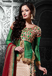 Take the fashion industry by storm in this beautiful embroidered lehengas. This beige viscose jacquard a-line lehenga choli is nicely embroidered patch border is done with resham, zari, stone and lace work. The beautiful embroidery on lehenga made it awesome and gives you stylish and attractive look to others. Contrasting green dupion and net choli and maroon net dupatta is availble with this lehenga. Slight Color variations are possible due to differing screen and photograph resolutions.
