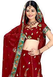 Bold colors created by the inventive drapes of textile catch the imagination like no other contemporary clothing. This maroon faux georgette lehenga is nicely embroidered patch work is done with resham, zari, sequins and stone work. The beautiful embroidery on lehenga made it awesome and gives you stylish and attractive look to others. Matching choli and dupatta is availble with this lehenga. Slight Color variations are possible due to differing screen and photograph resolutions.