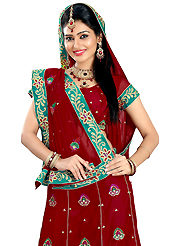 Welcome to the new era of Indian fashion wear. This dark red faux georgette lehenga is nicely embroidered patch work is done with resham, zari, sequins and stone work. The beautiful embroidery on lehenga made it awesome and gives you stylish and attractive look to others. Matching choli and dupatta is availble with this lehenga. Slight Color variations are possible due to differing screen and photograph resolutions.