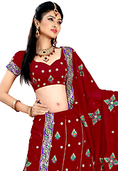 Make your collection more attractive and charming with this impressive dress. This maroon faux georgette lehenga is nicely embroidered patch work is done with resham, zari, sequins and stone work. The beautiful embroidery on lehenga made it awesome and gives you stylish and attractive look to others. Matching choli and dupatta is availble with this lehenga. Slight Color variations are possible due to differing screen and photograph resolutions.