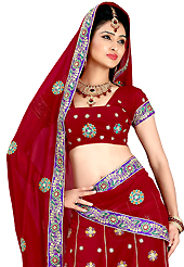 Elegance and innovation of designs crafted for you. This dark red faux georgette lehenga is nicely embroidered patch work is done with resham, zari, sequins and stone work. The beautiful embroidery on lehenga made it awesome and gives you stylish and attractive look to others. Matching choli and dupatta is availble with this lehenga. Slight Color variations are possible due to differing screen and photograph resolutions.