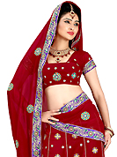 Elegance and innovation of designs crafted for you. This dark red faux georgette lehenga is nicely embroidered patch work is done with resham, zari, sequins and stone work. The beautiful embroidery on lehenga made it awesome and gives you stylish and attractive look to others. Matching choli and dupatta is availble with this lehenga. Slight Color variations are possible due to differing screen and photograph resolutions.