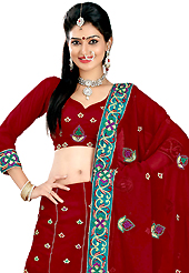 Be the cynosure of all eyes with this wonderful casual wear in flattering colors and combinations. This dark red faux georgette lehenga is nicely embroidered patch work is done with resham, zari, sequins and stone work. The beautiful embroidery on lehenga made it awesome and gives you stylish and attractive look to others. Matching choli and dupatta is availble with this lehenga. Slight Color variations are possible due to differing screen and photograph resolutions.
