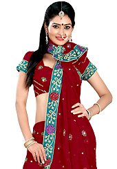 An occasion wear perfect is ready to rock you. This dark red faux georgette lehenga is nicely embroidered patch work is done with resham, zari, sequins and stone work. The beautiful embroidery on lehenga made it awesome and gives you stylish and attractive look to others. Matching choli and dupatta is availble with this lehenga. Slight Color variations are possible due to differing screen and photograph resolutions.