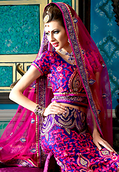 Today’s fashion is really about sensuality which can be seen in this creation. This dark blue and dark pink art silk a-line lehenga choli is nicely embroidered patch border is done with resham, zari, sequins, stone and lace work. The beautiful embroidery on lehenga made it awesome and gives you stylish and attractive look to others. Matching choli and net dupatta is availble with this lehenga. Slight Color variations are possible due to differing screen and photograph resolutions.