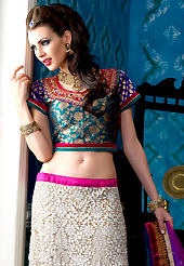 Outfit is a novel ways of getting yourself noticed. This off white net a-line lehenga choli is nicely embroidered patch border is done with resham, zari, sequins, stone and lace work. The beautiful embroidery on lehenga made it awesome and gives you stylish and attractive look to others. Contrasting turquoise blue brocade choli and purple net dupatta is availble with this lehenga. Slight Color variations are possible due to differing screen and photograph resolutions.