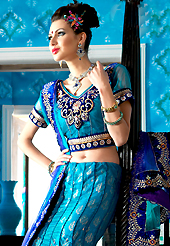 Welcome to the new era of Indian fashion wear. This blue net a-line lehenga choli is nicely embroidered patch border is done with resham, zari, sequins, stone and lace work. The beautiful embroidery on lehenga made it awesome and gives you stylish and attractive look to others. Matching choli and dupatta is availble with this lehenga. Slight Color variations are possible due to differing screen and photograph resolutions.