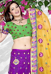 No one like ordinary look, because every woman has their own beauty and our collection gives extra ordinary look to you. This purple net a-line lehenga is nicely embroidered patch work is done with resham and stone work. The beautiful embroidery on lehenga made it awesome and gives you stylish and attractive look to others. Contrasting green choli and dark yellow net dupatta is availble with this lehenga. Slight Color variations are possible due to differing screen and photograph resolutions.