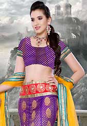 An occasion wear perfect is ready to rock you. This purple net lehenga is nicely embroidered patch work is done with zari, stone and lace work. The beautiful embroidery on lehenga made it awesome and gives you stylish and attractive look to others. Matching choli and yellow net dupatta is availble with this lehenga. Slight Color variations are possible due to differing screen and photograph resolutions.