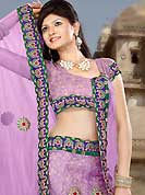 An occasion wear perfect is ready to rock you. This lavender net lehenga is nicely embroidered patch work is done with resham, zari and stone work. The beautiful embroidery on lehenga made it awesome and gives you stylish and attractive look to others. Matching choli and dupatta is availble with this lehenga. Slight Color variations are possible due to differing screen and photograph resolutions.