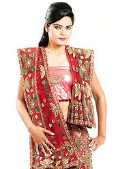 Make your collection more attractive and charming with this impressive dress. This dark red net lehenga is nicely embroidered patch work is done with zari, cutdana, sequins, zardosi, stone, beads and cutbeads work. The beautiful embroidery on lehenga made it awesome and gives you stylish and attractive look to others. Matching choli and dupatta is availble with this lehenga. Slight Color variations are possible due to differing screen and photograph resolutions.