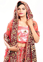 An occasion wear perfect is ready to rock you. This red net lehenga is nicely embroidered and velvet patch work is done with cutdana, sequins, stone, beads and cutbeads work. The beautiful embroidery on lehenga made it awesome and gives you stylish and attractive look to others. Matching choli and dupatta is availble with this lehenga. Slight Color variations are possible due to differing screen and photograph resolutions.