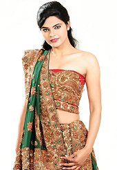 It’s cool and has a very modern look to impress all. This gold and green georgette lehenga is nicely embroidered patch work is done with cutdana, sequins, stone, beads and cutbeads work. The beautiful embroidery on lehenga made it awesome and gives you stylish and attractive look to others. Contrasting red choli and green dupatta is availble with this lehenga. Slight Color variations are possible due to differing screen and photograph resolutions.