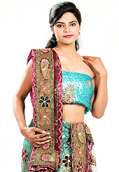 Take a look on the changing fashion of the season. This turquoise blue net lehenga is nicely embroidered and velvet patch work is done with cutdana, sequins, stone, beads and cutbeads work. The beautiful embroidery on lehenga made it awesome and gives you stylish and attractive look to others. Matching choli and dark magenta net dupatta is availble with this lehenga. Slight Color variations are possible due to differing screen and photograph resolutions.