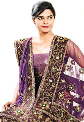 Dreamy variation on shape and forms compliment your style with tradition. This purple net lehenga is nicely embroidered patch work is done with zardosi, cutdana, stone, beads and cutbeads work. The beautiful embroidery on lehenga made it awesome and gives you stylish and attractive look to others. Matching choli and dupatta is availble with this lehenga. Slight Color variations are possible due to differing screen and photograph resolutions.
