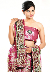 Outfit is a novel ways of getting yourself noticed. This dark pink net lehenga is nicely embroidered and velvet patch work is done with zardosi, cutdana, stone, beads and cutbeads work. The beautiful embroidery on lehenga made it awesome and gives you stylish and attractive look to others. Matching choli and red net dupatta is availble with this lehenga. Slight Color variations are possible due to differing screen and photograph resolutions.
