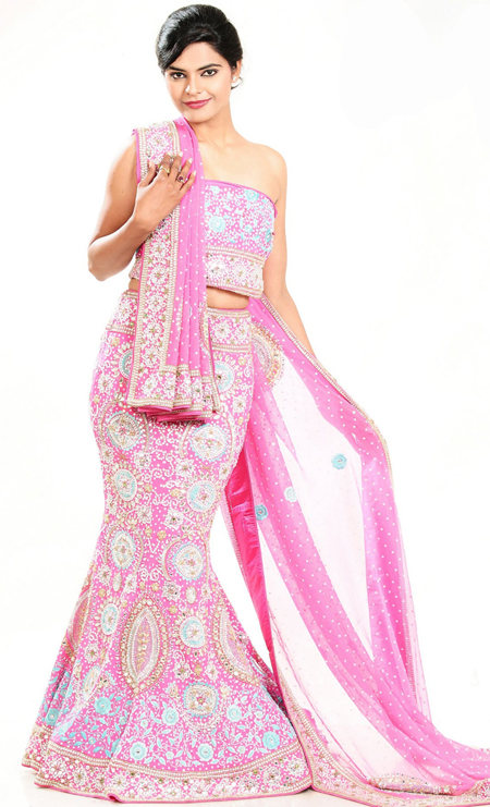 Embroidered lehengas are highly in order on a range of occasions such as wedding, formal party and festivals. This pink crepe silk lehenga is nicely embroidered patch work is done with zardosi, cutdana, stone, beads and cutbeads work. The beautiful embroidery on lehenga made it awesome and gives you stylish and attractive look to others. Matching choli and dupatta is availble with this lehenga. Slight Color variations are possible due to differing screen and photograph resolutions.