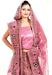 Dreamy variation on shape and forms compliment your style with tradition. This pink georgette lehenga is nicely embroidered and velvet patch work is done with zardosi, cutdana, stone, beads and cutbeads work. The beautiful embroidery on lehenga made it awesome and gives you stylish and attractive look to others. Matching choli and dupatta is availble with this lehenga. Slight Color variations are possible due to differing screen and photograph resolutions.