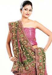 Make your collection more attractive and charming with this impressive dress. This pink net lehenga is nicely embroidered and velvet patch work is done with zardosi, cutdana, stone, beads and cutbeads work. The beautiful embroidery on lehenga made it awesome and gives you stylish and attractive look to others. Matching choli and dupatta is availble with this lehenga. Slight Color variations are possible due to differing screen and photograph resolutions.