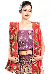 The evolution of style species collection spells pure femininity. This dark purple net lehenga is nicely embroidered and velvet patch work is done with zardosi, cutdana, stone, beads and cutbeads work. The beautiful embroidery on lehenga made it awesome and gives you stylish and attractive look to others. Matching choli and red net dupatta is availble with this lehenga. Slight Color variations are possible due to differing screen and photograph resolutions.