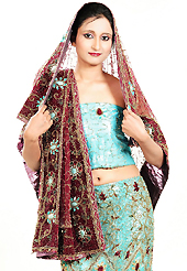 Get ready to sizzle all around you by sparkling lehenga. This light blue net lehenga is nicely embroidered and velvet patch work is done with zardosi, cutdana, stone, beads and cutbeads work. The beautiful embroidery on lehenga made it awesome and gives you stylish and attractive look to others. Matching choli and maroon net dupatta is availble with this lehenga. Slight Color variations are possible due to differing screen and photograph resolutions.