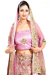 Take a look on the changing fashion of the season. This pink net lehenga is nicely embroidered patch work is done with cutdana, sequins, stone, beads and cutbeads work. The beautiful embroidery on lehenga made it awesome and gives you stylish and attractive look to others. Matching choli and dupatta is availble with this lehenga. Slight Color variations are possible due to differing screen and photograph resolutions.
