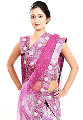Let your personality speak for you this wedding lehenga embellished with embroidery work. This pink net lehenga is nicely embroidered patch work is done with zardosi, cutdana, sequins, stone, beads and cutbeads work. The beautiful embroidery on lehenga made it awesome and gives you stylish and attractive look to others. Matching choli and dupatta is availble with this lehenga. Slight Color variations are possible due to differing screen and photograph resolutions.
