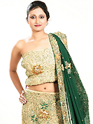 Make your collection more attractive and charming with this impressive dress. This dark cream georgette lehenga is nicely embroidered patch work is done with zardosi, cutdana, stone, beads and cutbeads work. The beautiful embroidery on lehenga made it awesome and gives you stylish and attractive look to others. Matching choli and green dupatta is availble with this lehenga. Slight Color variations are possible due to differing screen and photograph resolutions.