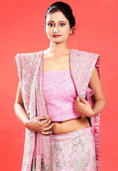 An occasion wear perfect is ready to rock you. This pink net lehenga is nicely embroidered patch work is done with zardosi, cutdana, stone, beads and cutbeads work. The beautiful embroidery on lehenga made it awesome and gives you stylish and attractive look to others. Matching choli and dupatta is availble with this lehenga. Slight Color variations are possible due to differing screen and photograph resolutions.