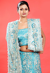 Today’s fashion is really about sensuality which can be seen in this creation. This blue net lehenga is nicely embroidered patch work is done with zardosi, cutdana, sequins, stone, beads and cutbeads work. The beautiful embroidery on lehenga made it awesome and gives you stylish and attractive look to others. Matching choli and dupatta is availble with this lehenga. Slight Color variations are possible due to differing screen and photograph resolutions.