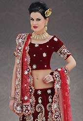 Welcome to the new era of Indian fashion wear. This maroon velvet lehenga choli is nicely embroidered patch work is done with stone, zardosi, cutdana and cutbeads work. All over embroidery work on lehenga is stunning. The beautiful heavy embroidery on lehenga made it awesome and gives you stylish and attractive look to others. Matching choli and red net dupatta is availble with this lehenga. Slight Color variations are possible due to differing screen and photograph resolutions.