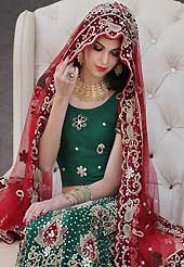 The evolution of style species collection spells pure femininity. This green net lehenga choli is nicely embroidery and velvet patch work is done with stone, zardosi, cutdana, beads and cutbeads work. All over embroidery work on lehenga is stunning. The beautiful heavy embroidery on lehenga made it awesome and gives you stylish and attractive look to others. Matching choli and red net dupatta is availble with this lehenga. Slight Color variations are possible due to differing screen and photograph resolutions.