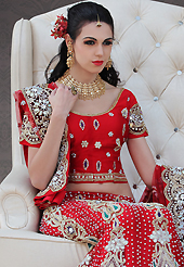 Outfit is a novel ways of getting yourself noticed. This red net lehenga choli is nicely embroidery and velvet patch work is done with resham, stone, zardosi, cutdana, beads and cutbeads work. All over embroidery work on lehenga is stunning. The beautiful heavy embroidery on lehenga made it awesome and gives you stylish and attractive look to others. Matching choli and dupatta is availble with this lehenga. Slight Color variations are possible due to differing screen and photograph resolutions.