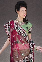 Welcome to the new era of Indian fashion wear. This light green net lehenga choli is nicely embroidery and velvet patch work is done with stone, zardosi, cutdana and cutbeads work. All over embroidery work on lehenga is stunning. The beautiful heavy embroidery on lehenga made it awesome and gives you stylish and attractive look to others. Matching choli and dark magenta net dupatta is availble with this lehenga. Slight Color variations are possible due to differing screen and photograph resolutions.