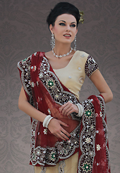 It’s cool and has a very modern look to impress all. This dark cream net lehenga choli is nicely embroidery and velvet patch work is done with stone, cutdana and cutbeads work. All over embroidery work on lehenga is stunning. The beautiful heavy embroidery on lehenga made it awesome and gives you stylish and attractive look to others. Matching choli and maroon net dupatta is availble with this lehenga. Slight Color variations are possible due to differing screen and photograph resolutions.
