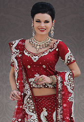 Let your personality speak for you this wedding lehenga embellished with embroidery work. This maroon net lehenga choli is nicely embroidery and velvet patch work is done with stone, zardosi, cutdana, beads and cutbeads work. All over embroidery work on lehenga is stunning. The beautiful heavy embroidery on lehenga made it awesome and gives you stylish and attractive look to others. Matching choli and dupatta is availble with this lehenga. Slight Color variations are possible due to differing screen and photograph resolutions.